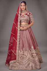 The Majestic Maroon Banarasi Silk Bridal Lehenga Ensemble with Jharokha Zardosi Blouse and Sheer Scalloped Veil