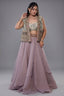 Muted Mauve Tissue Asymmetric Layered Lehenga Set With Heavily Embroidered Fusion Jacket