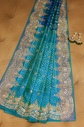 Turquoise Blue Silk Patola Saree with Zardosi Sequin Worked Scallop Border