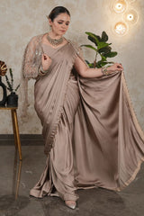 Taupe Satin Silk Pre Stitched Saree Featuring with a Narrow Embellished and Cutdana Short Cape Jacket