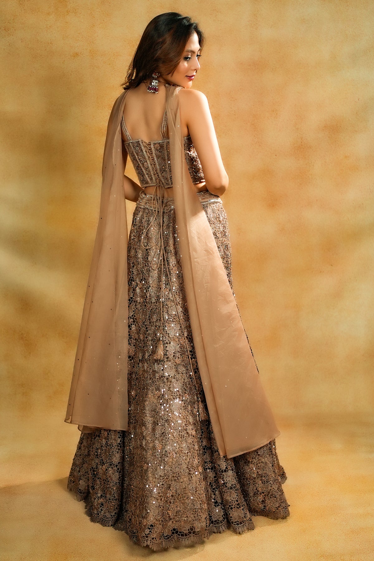 Rose Gold Net Sequinned Fish Cut Lehenga with Corset Blouse
