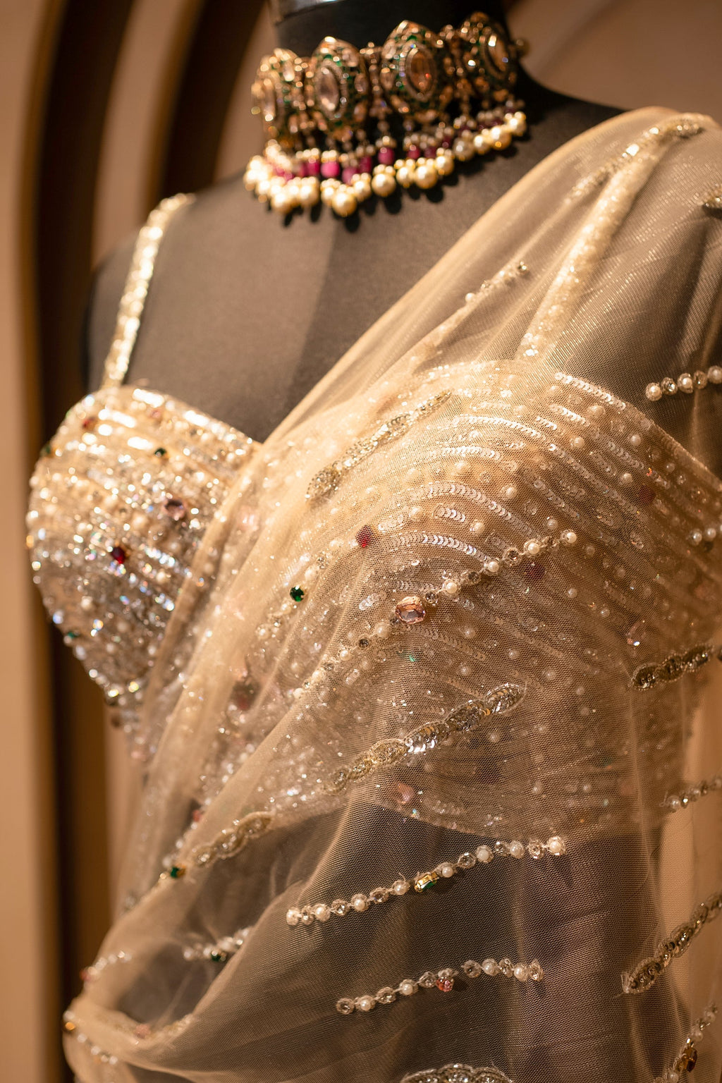 Champagne Gold Net Mermaid Lehenga with Attached Cape-Style Dupatta & Intricate Cutdana Work