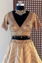 Golden Tissue Silk Lehenga with Kundan Worked Blouse