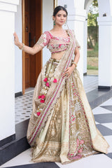 The Olive Green Shaded Brocade Silk Woven Lehenga Ensemble with Jharokha Embroidered Sweetheart Blouse and Attached Organza Dupatta