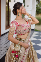 The Olive Green Shaded Brocade Silk Woven Lehenga Ensemble with Jharokha Embroidered Sweetheart Blouse and Attached Organza Dupatta