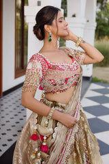 The Olive Green Shaded Brocade Silk Woven Lehenga Ensemble with Jharokha Embroidered Sweetheart Blouse and Attached Organza Dupatta