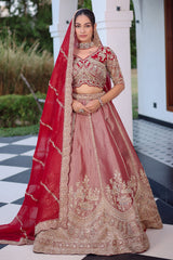 The Majestic Maroon Banarasi Silk Bridal Lehenga Ensemble with Jharokha Zardosi Blouse and Sheer Scalloped Veil