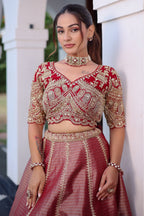 The Majestic Maroon Banarasi Silk Bridal Lehenga Ensemble with Jharokha Zardosi Blouse and Sheer Scalloped Veil