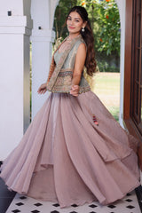 Muted Mauve Tissue Asymmetric Layered Lehenga Set With Heavily Embroidered Fusion Jacket