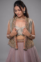 Muted Mauve Tissue Asymmetric Layered Lehenga Set With Heavily Embroidered Fusion Jacket