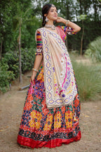 The Rajwadi Patola Silk Lehenga Ensemble With Scalloped V-Neck Hand-Embellished Blouse And Sheer Organza Tissue Dupatta