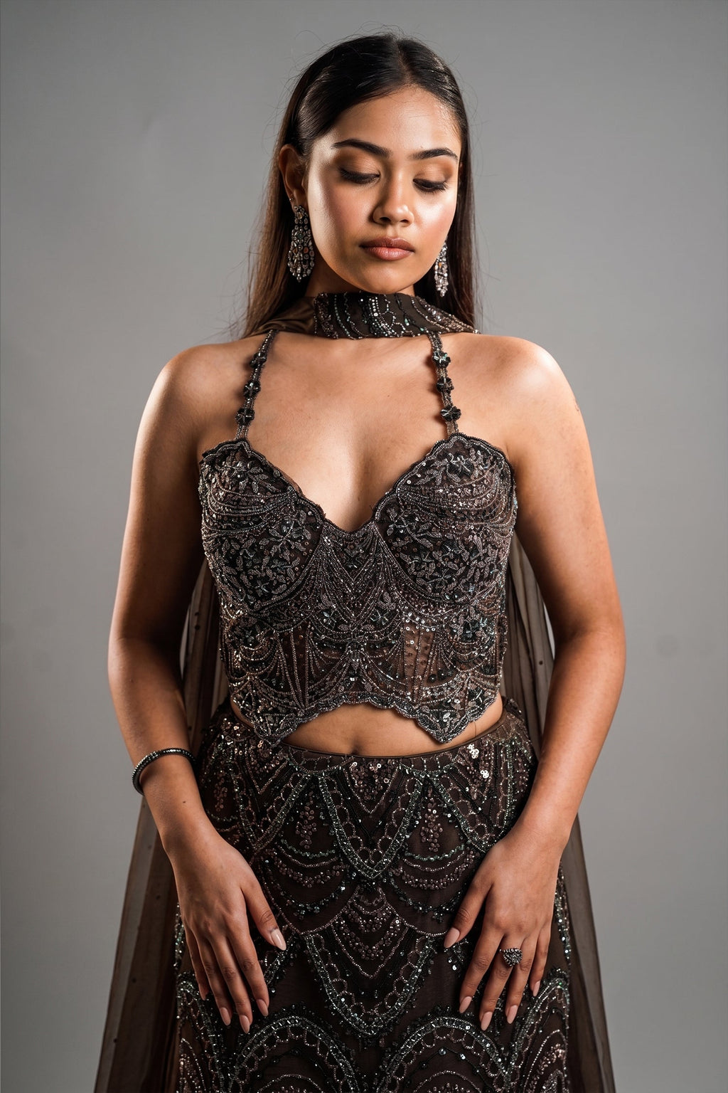 Charcoal Brown Net Lehenga Set with Wave-Patterned Cutdana and Sequin Sweetheart Bustier