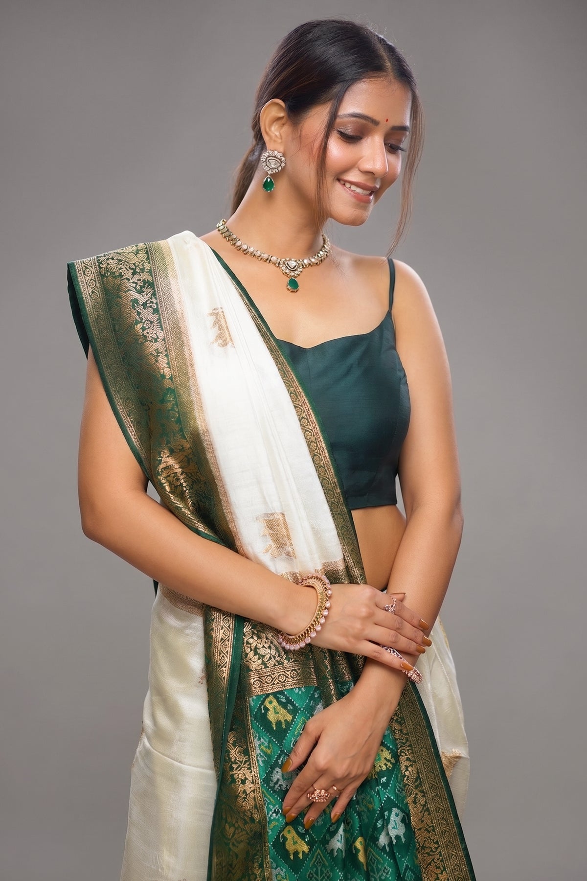Off White Dola Silk Woven Butta Saree with Contrast Patola Border