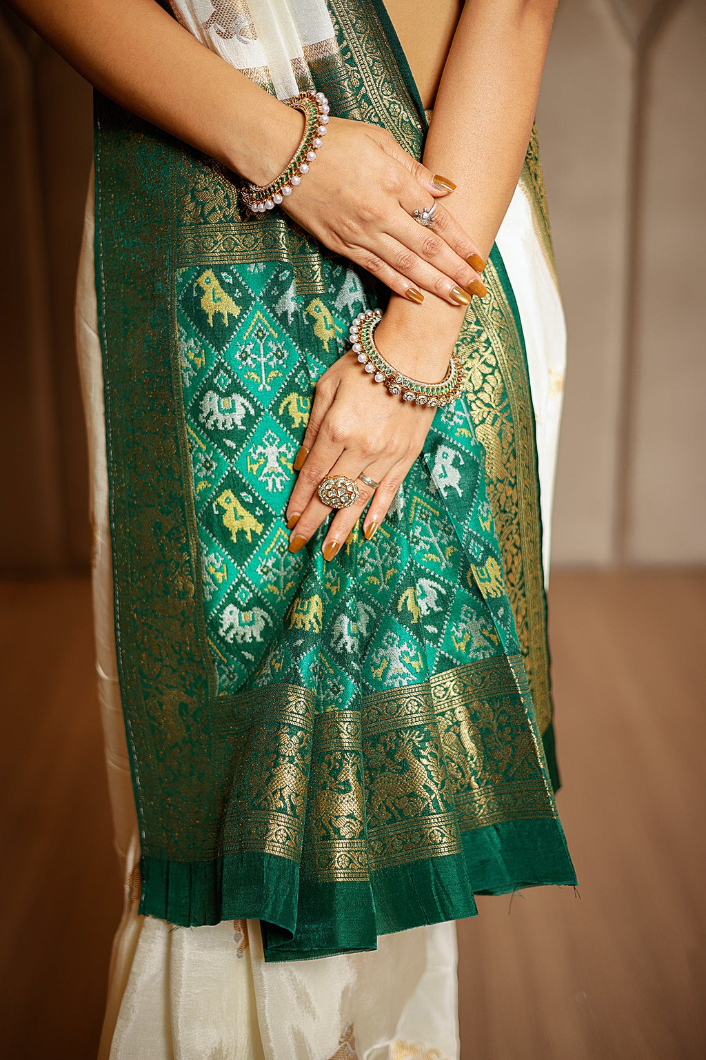 Off White Dola Silk Woven Butta Saree with Contrast Patola Border