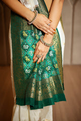 Off White Dola Silk Woven Butta Saree with Contrast Patola Border