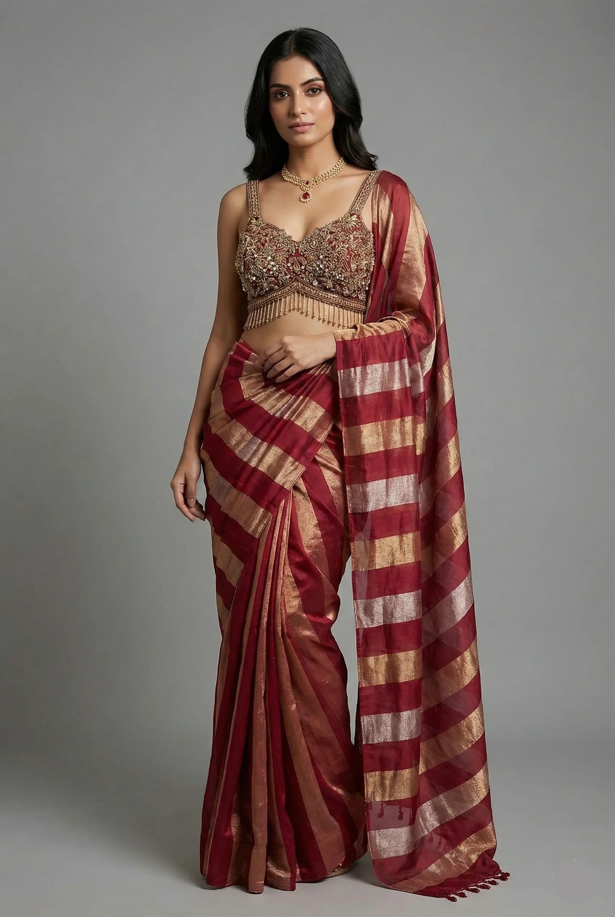 Maroon and Gold Striped Saree with Heavily Embellished Blouse
