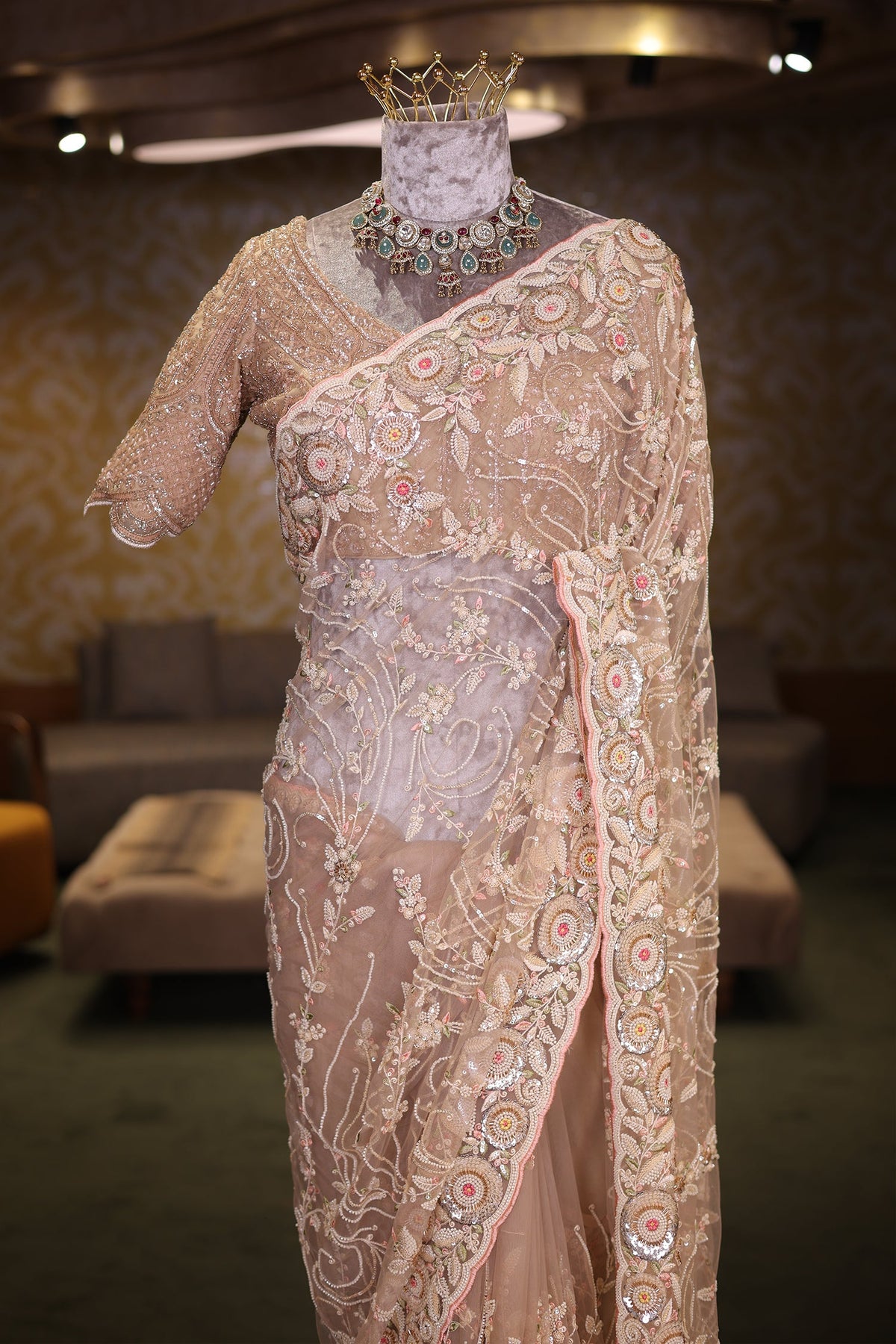 Beige Net Designer Saree Enriched With Glamorous Sequins And Cutdana Hand Embroidery