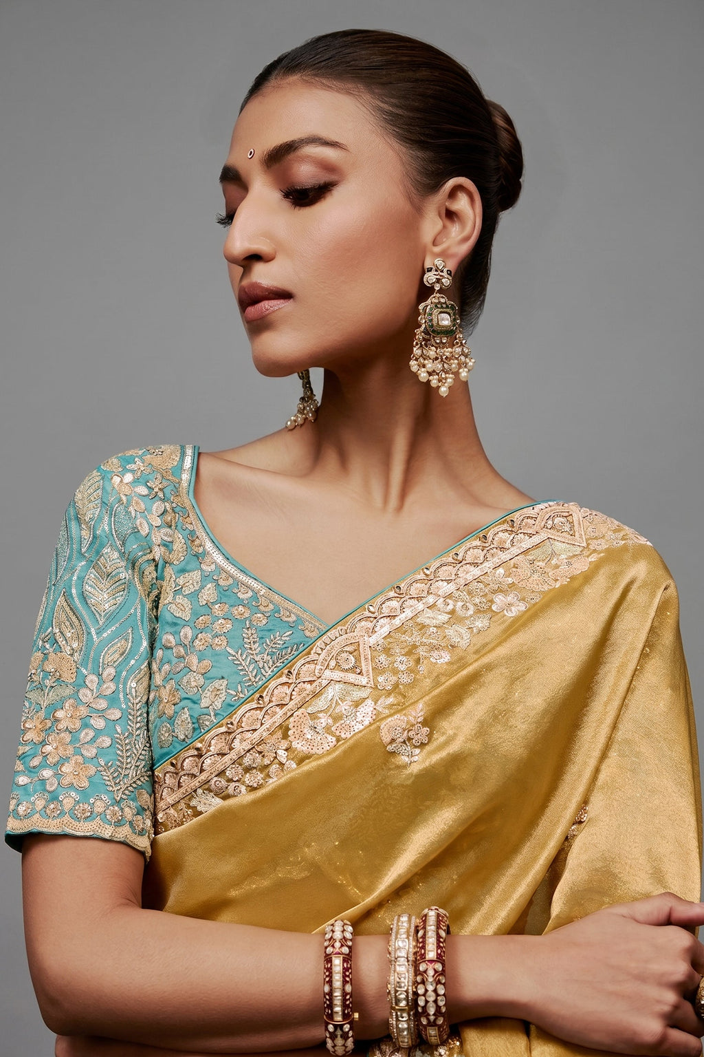 Mustard Gold Saree With Contrasting Turquoise Blue Embroidered Blouse In Cutdana Work
