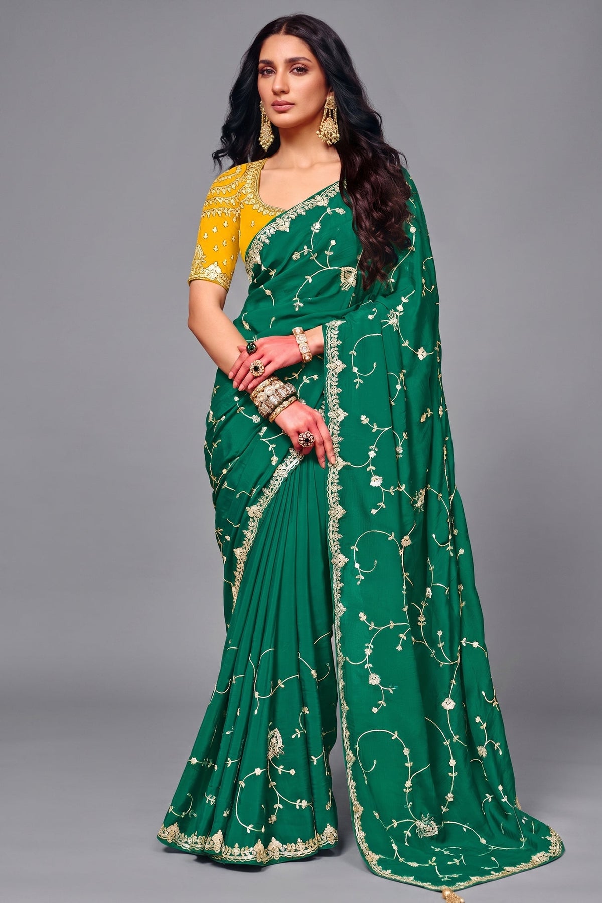 Emerald Green Satin Silk Saree With Heavy Sequin Work And Contrasting Yellow Blouse Main image