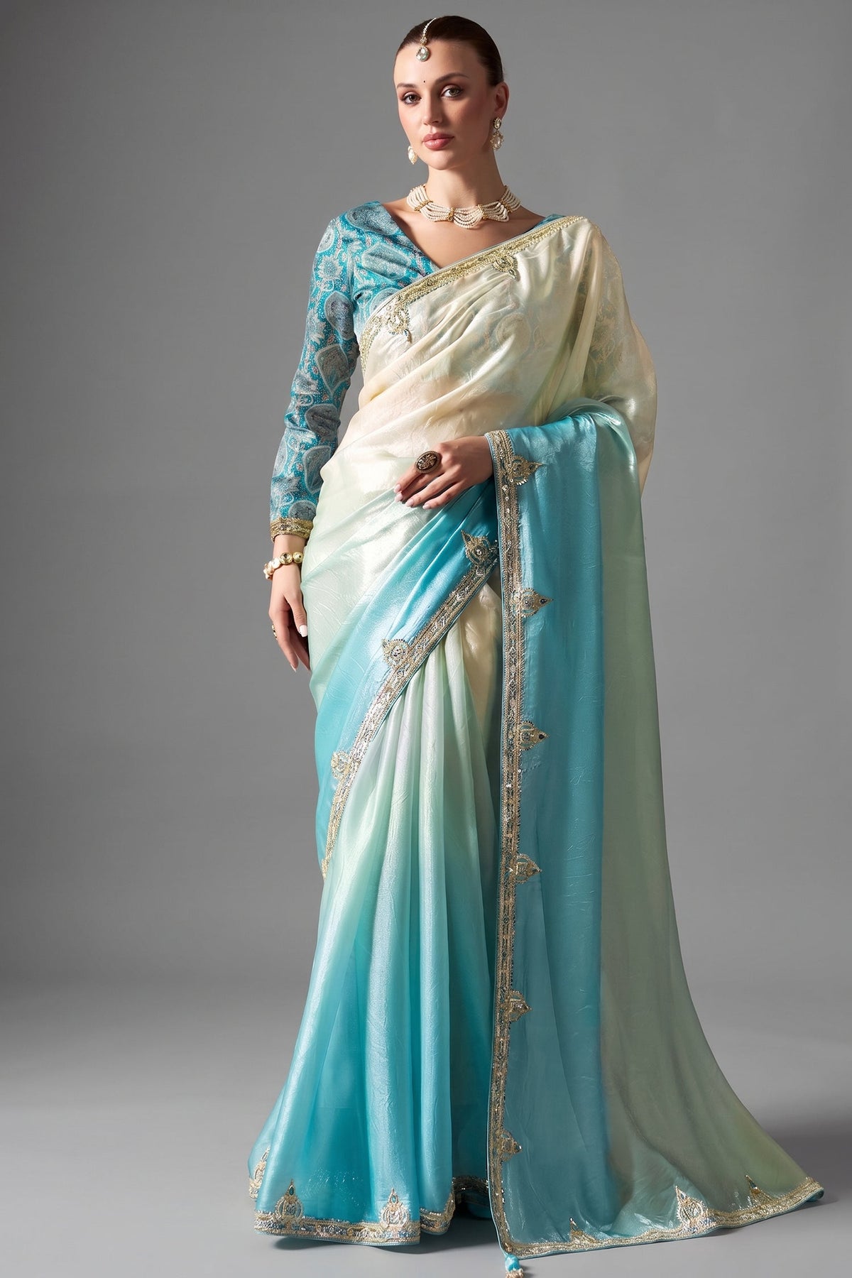 Ombre Sky Blue Tissue Saree Embellished With Sequins And Paired With A Matching Azure Print Blouse. Main image