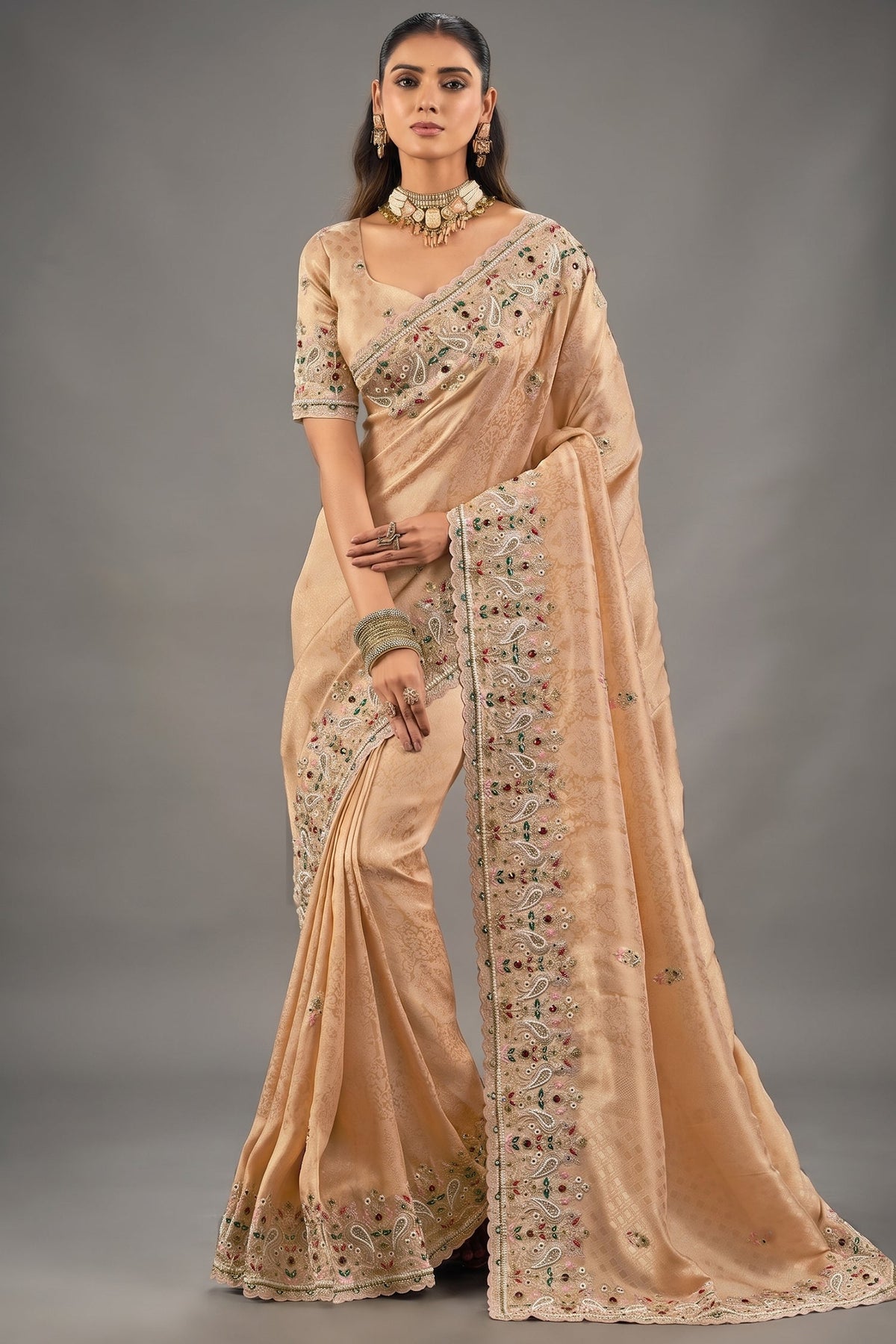 Champagne Peach Kanjivaram Silk Saree with Emerald Paisley Border Main image