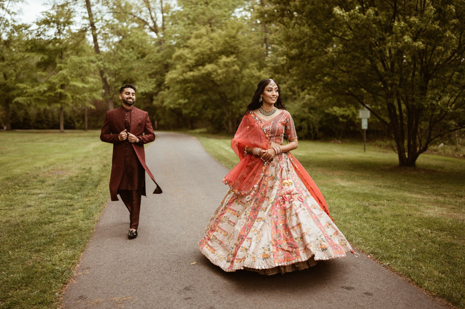 Asopalav couple walking outdoors in wedding attire