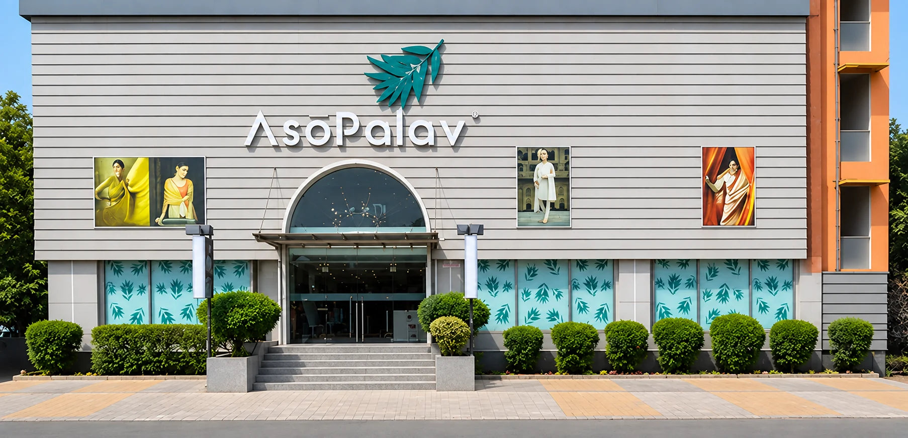 Asopalav Vadaj storefront in Ahmedabad, with its leaf logo, arched entrance and landscaped frontage
